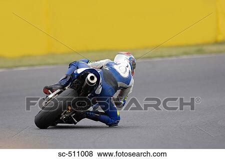 Racing motor bike cornering at extreme angle View Large Photo Image Stock Photo - Racing motor bike cornering at extreme angle. Fotosearch