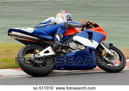 Racing motor bike cornering View Large Photo Image Stock Image - Racing motor bike cornering. Fotosearch
