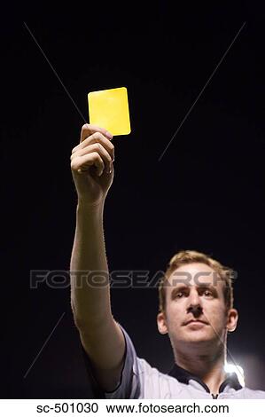 Stock Image - Ref Showing Yellow Card. Fotosearch