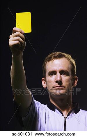 Stock Image - Ref Showing Yellow Card. Fotosearch