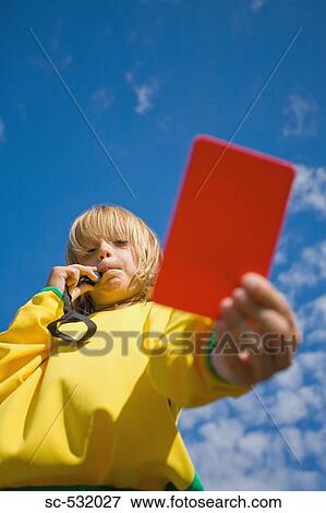 Referee blowing whistle and showing red card View Large Photo Image Stock Photo - Referee blowing whistle and showing red card. Fotosearch