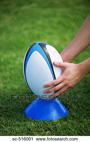 Stock Image - Rugby Ball On A Tee. Fotosearch