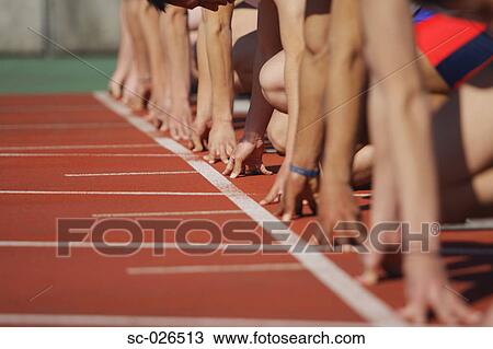 Stock Image - Runners at Starting Line. Fotosearch