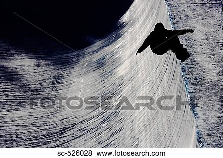 Stock Photo - Silhouette of a person snowboarding. Fotosearch