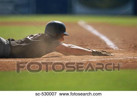 Sliding into Base View Large Photo Image Stock Photo - Sliding into Base. Fotosearch