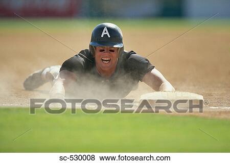 Stock Photo - Sliding into Base. Fotosearch