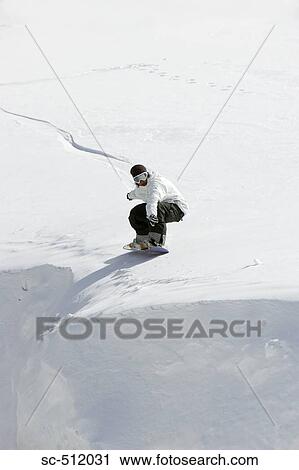 Stock Image - Snowboarder in action. Fotosearch