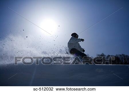 Stock Image - Snowboarder in action. Fotosearch