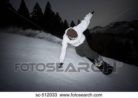 Stock Image - Snowboarder in action. Fotosearch