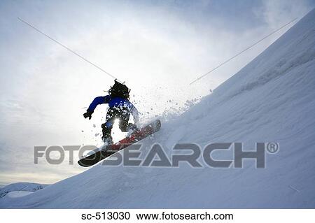 Stock Image - Snowboarder in action . Fotosearch