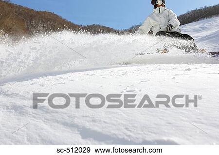 Stock Photo - Snowboarder in action. Fotosearch