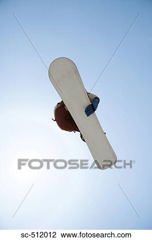Snowboarder in mid air View Large Photo Image Stock Image - Snowboarder in mid air. Fotosearch