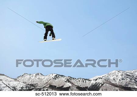 Snowboarder in mid air View Large Photo Image Stock Image - Snowboarder in mid air. Fotosearch