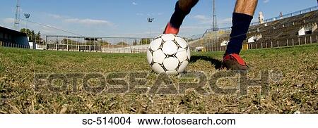 Picture - Soccer ball being kicked. Fotosearch