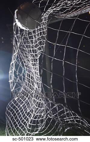 Stock Image - Soccer Ball Flying Into Net. Fotosearch