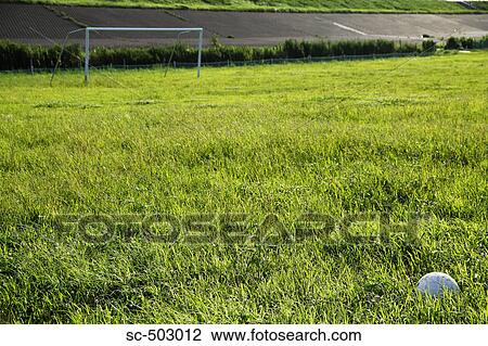 Stock Image - Soccer Ball Lying On a Soccer Pitch. Fotosearch