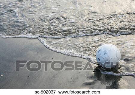 Stock Photo - Soccer Ball On A Beach. Fotosearch