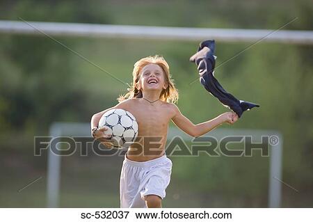 Stock Photo - Soccer Boy running Shirtless. Fotosearch