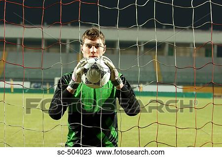 Stock Image - Soccer Goalie Holding a Soccer Ball. Fotosearch