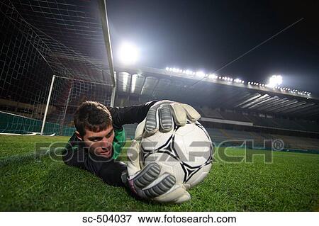 Stock Photo - Soccer Goalie Making A Save. Fotosearch