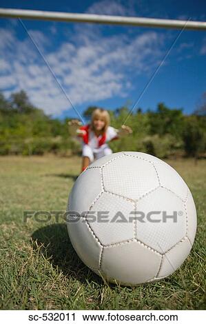 Stock Image - Soccer goalkeeper diving for ball. Fotosearch
