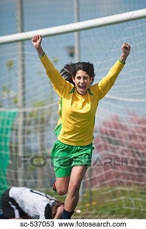 Stock Image - Soccer player celebrating victory. Fotosearch
