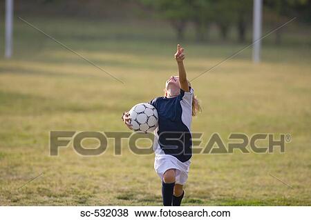 Stock Photo - Soccer player cheering and yelling. Fotosearch