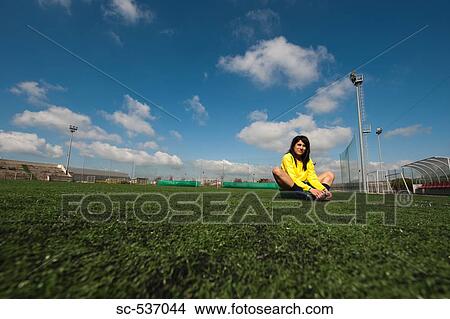 Picture - Soccer player exercising in soccer field. Fotosearch