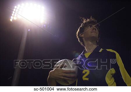 Soccer Player Holding Ball View Large Photo Image Picture - Soccer Player Holding Ball. Fotosearch