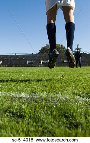 Stock Photo - Soccer player jumping. Fotosearch