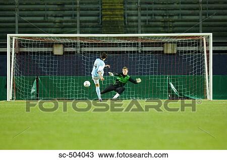 Stock Image - Soccer Player Makes a Goal. Fotosearch