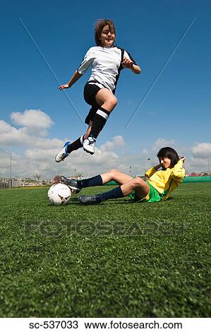 Soccer player obstructing her opponent View Large Photo Image Stock Image - Soccer player obstructing her opponent . Fotosearch