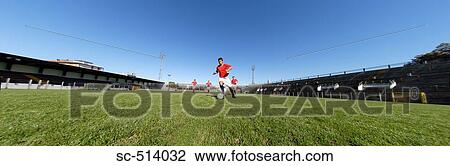 Stock Image - Soccer player on a break away. Fotosearch