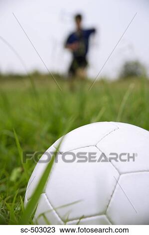 Stock Image - Soccer Player Running To Kick A Soccer Ball. Fotosearch