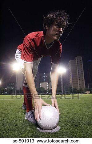 Stock Image - Soccer Player Setting A Penalty Kick. Fotosearch