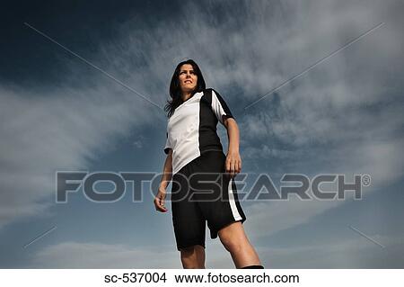 Picture - Soccer player standing in sports uniform. Fotosearch