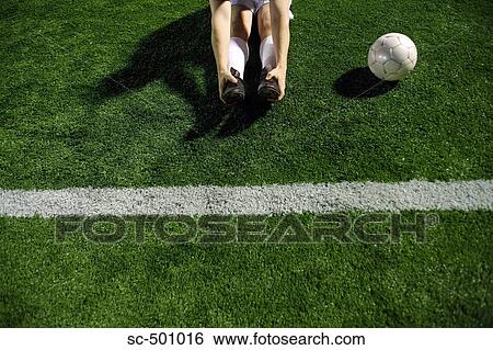 Soccer Player Stretching By Sideline View Large Photo Image Stock Photograph - Soccer Player Stretching By Sideline. Fotosearch