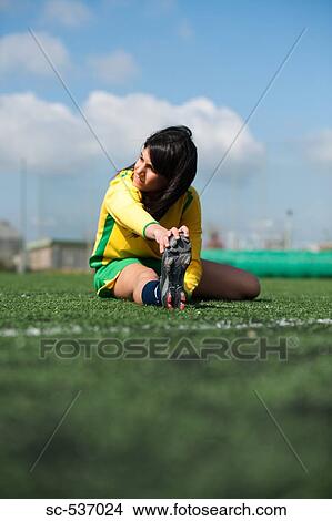 Picture - Soccer player stretching . Fotosearch