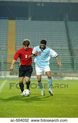 Soccer Player Tackling View Large Photo Image Stock Image - Soccer Player Tackling . Fotosearch