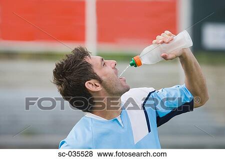 Stock Photo - Soccer player taking a break. Fotosearch