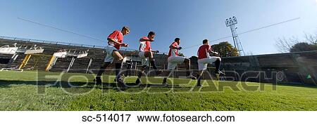 Soccer players doing warm up drills View Large Photo Image Stock Photo - Soccer players doing warm up drills . Fotosearch
