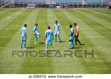 Stock Photography - Soccer players juggling ball. Fotosearch