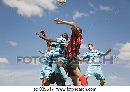 Stock Photo - Soccer players jumping for header. Fotosearch