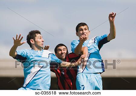 Stock Photo - Soccer players jumping for header. Fotosearch