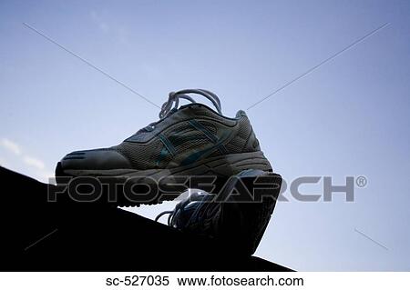 Sport shoes with blue sky View Large Photo Image Stock Photography - Sport shoes with blue sky. Fotosearch