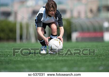 Sportswoman playing soccer View Large Photo Image Stock Image - Sportswoman playing soccer. Fotosearch