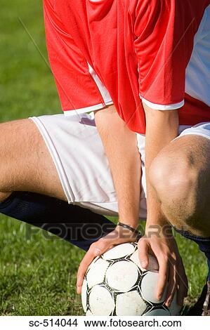 Squatting on a ball View Large Photo Image Picture - Squatting on a ball. Fotosearch