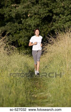 Teenage Girl Running in Countryside View Large Photo Image Stock Image - Teenage Girl Running in Countryside. Fotosearch