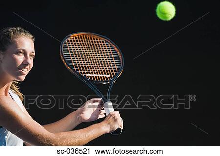 Tennis player hitting backhand return View Large Photo Image Stock Image - Tennis player hitting backhand return. Fotosearch