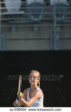Tennis player serving View Large Photo Image Picture - Tennis player serving. Fotosearch